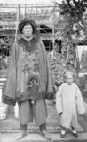 The 'Giant of Yunnan' was an unusually tall and large man from Yunnan in southwest China who featured in several contemporaneous photographs by European travellers. The figure by his side is a Yunnanese dwarf or midget. The 'giant' appears to be wearing official yamen uniform and probably worked as a guard or bodyguard for a local official.