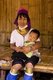 Thailand: Padaung (Long Neck Karen) woman and baby, Karen Long Neck Village and Seven Tribe Village, near Mae Taman, north of Chiang Mai