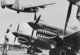 China: American Liberator bomber flies over Flying Tiger  P-40 fighters, Kunming, c1942.